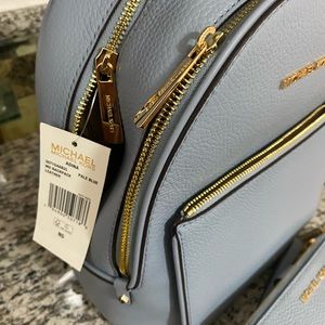 Authentic Michael Kors backpack and $138 wallet.